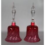 A pair of cranberry glass hand bells