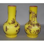 A pair of yellow glass gilt enamelled vases