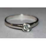 A platinum and solitaire diamond ring. size M.