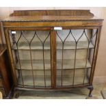 A mahogany bow front display cabinet, W.121cm