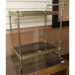 A French gilt metal two-tier drinks trolley, W.68cm