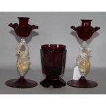 A pair of ruby swan glass candlesticks and an etched tumbler