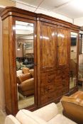 A large Victorian 'plum pudding' mahogany breakfront wardrobe, W.280cm H.241cm