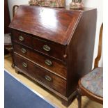 A George III mahogany bureau, with fitted interior, two short and two long drawers, W.107cm