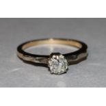 A gold and solitaire diamond ring, size O.