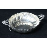 A late 19th/early 20th century silver two handled strawberry dish by Charles Edwards, London, 8.75in