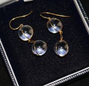 A pair of gold mounted double sphere drop earrings.