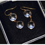 A pair of gold mounted double sphere drop earrings.