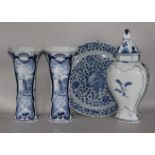 An 18th century Delft dish and a modern Delft three piece garniture