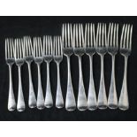 A set of six Victorian silver Old English pattern table forks and six dessert forks by George Adams,