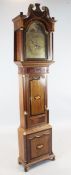 An early 19th century mahogany banded oak eight day longcase clock, the arched brass dial with