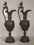 A pair of 19th century Florentine style bronze ewers, height 46cm