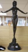 After Jules Jouane. A tall bronze figure of girl in a bikini, height 71cm