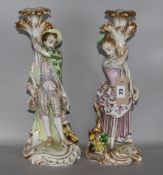 A pair of French porcelain candlesticks
