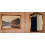 An arched gilt frame wall mirror, and an oil lake scene, W.70cm, H.90cm