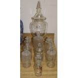 A collection of chemists jars and a large chemist lidded display jar