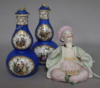 A pair of Dresden scent bottles and a pagoda figure a.f.
