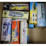 A collection of Corgi boxed coaches and buses