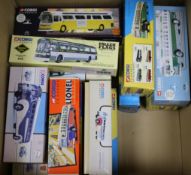 A collection of Corgi boxed coaches and buses