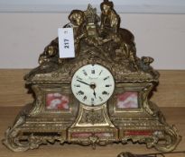 A Louis XV style gilt metal and rouge marble cased eight day mantel clock, height 35cm