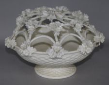 An ornate flower encrusted rose bowl