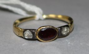 A Georgian rose cut diamond and garnet three stone ring, size H.