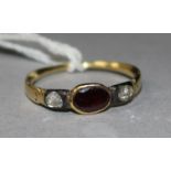 A Georgian rose cut diamond and garnet three stone ring, size H.