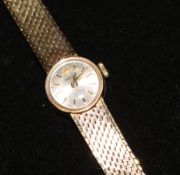 A lady's 9ct gold Rolex Precision manual wind wrist watch on a 9ct gold Rolex bracelet, in Rolex