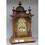 A late Victorian walnut mantel clock