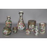 A group of Chinese Famille Rose vases, jars and covers