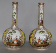 A pair of gilt & figurative vases
