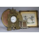 A Victorian brass strut timepiece and various picture frames