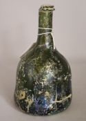 A mid 18th Century mallet shaped olive green bottle