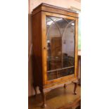 A 1950's walnut display cabinet, W.65cm H.132cm