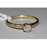 A gold and solitaire diamond ring, size O.