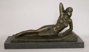 After Demetre Chiparus. A bronze Art Deco style reclining Egyptian dancer, height 21cm