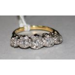 An 18ct gold, platinum and graduated five stone illusion set diamond ring, size K.