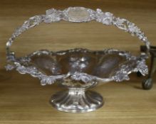 A Victorian plated cake basket, with vine cast border