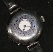 An early 20th century silver half hunter wrist watch.