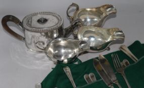 A silver sauceboat, cased silver 'apostle' teaspoon set, a silver fork and plated wares.