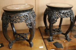 A pair of Chinese marble top tables, 52cm high