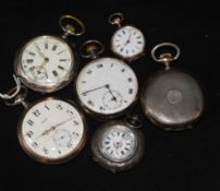 An engine turned silver Omega pocket watch, three other silver pocket watches and two silver fob