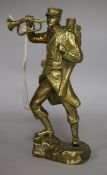 A brass model of a military figure, signed