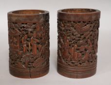 2 similar Chinese bamboo brush pots carved in relief of figures 19th Century