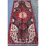 A Hamadan rug, 283cm x 120cm