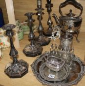A set of four Elkington plated candlesticks, a kettle, salvers and sundry plated flatware