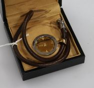 An Italian Bulgari 18ct gold and steel pendant, on a fabric necklace, with box.