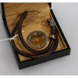 An Italian Bulgari 18ct gold and steel pendant, on a fabric necklace, with box.