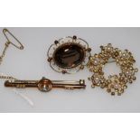 A 15ct gold and gem set bar brooch and two 9ct brooches.