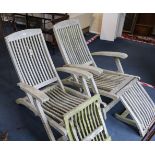 A pair of Indian Ocean teak folding loungers